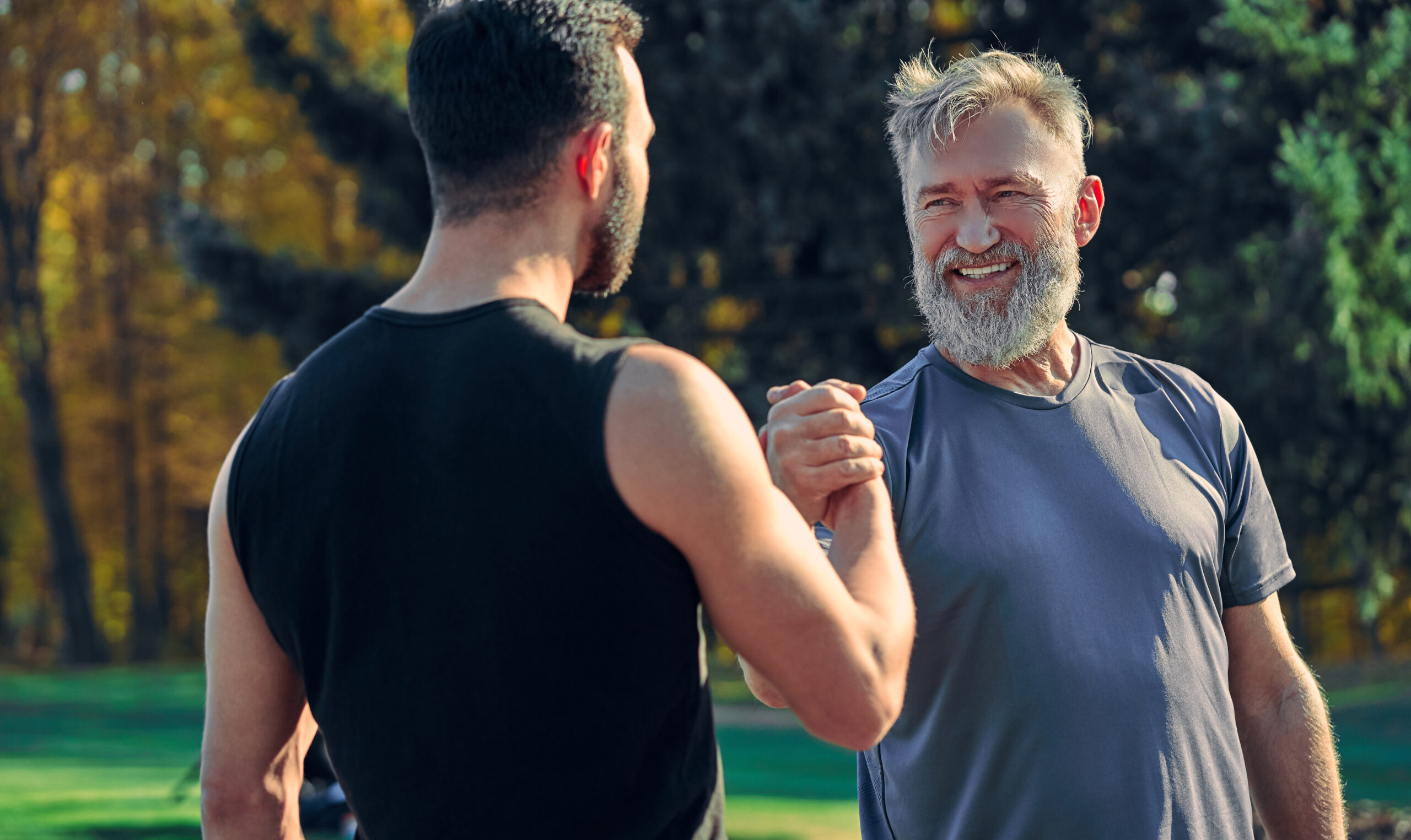 The two happy sportsmen greeting outdoor
